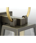 Close-up of Barnett Outdoor One Light Wall Lantern In Antique Bronze Finish, showcasing metal and clear glass design.