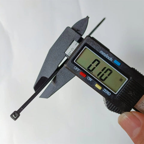 Digital caliper measuring 0.1-inch width of Beefy 4 Inch Zip Ties 1000 Pack Self Locking Nylon 66 Black Ties With 18 Lb Tensile Strength For Indoor And Outdoor Use UV Resistant Weatherproof Cable Tie Wraps