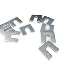 Pro Grade Alignment Shim Set For Auto Body And Fender Adjustments Includes One Sixteenth Inch And One Eighth Inch Thick Shims With Three Eighths Inch Slot 30 Pieces Zinc Plated For Rust Resistance Resealable Storage Box Camber Toe And Caster Alignment. Close-up of zinc plated shims.