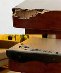Solid As A Rock Metal Corner Protectors For Furniture Featuring Dope Vintage Floral Accents Seriously Rust Resistant Heavy Duty Edge Guards on a damaged table corner.