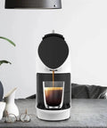 Compact Smart Automatic Capsule Coffee Machine With Grind And Brew Tech One Touch Espresso Maker dispensing coffee on table