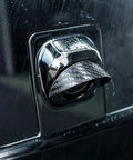 Close-up of Four Piece Backup Camera Rain Shields For Tesla Cybertruck, showcasing weatherproof lens cover in the rain.