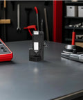 Heavy Duty Hammer Lug Crimping Tool For Automotive Wiring And Industrial Projects on workbench, showcasing durable design and precise action.