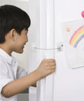 Child interacting with 2 Pack Childproof Safety Locks For Refrigerator, Cabinets And Windows, Multipurpose Fall Prevention Locks Made From Durable ABS And Steel Wire, Sleek Design, Easy Install, Keeps Kids Safe At Home on a white fridge