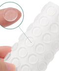 Cabinet door bumpers, 64 pcs, clear self-adhesive, 0.5 in diameter — close-up view