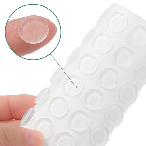 Cabinet door bumpers, 64 pcs, clear self-adhesive, 0.5 in diameter — close-up view