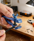 Heavy Duty Handheld Vise Pliers 50mm Mini Bench Clamp For DIY And Home Use, Cast Iron Body With Carbon Steel Jaws securing a wire.