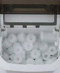 No Sweat Countertop Bullet Ice Cube Maker With 1.1 Liter Tank filled with fresh ice cubes ready for use.