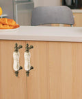 Ceramic Cabinet Pulls Marble Pattern 3 Inch Center Holes Antique Brown Granite Look installed on kitchen cabinet