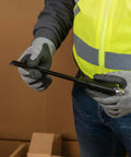 Person holding 12 Inch Duct Slitter Hand Sheet Slicer for cutting metal pipes and duct work, showing beveled notch tip.