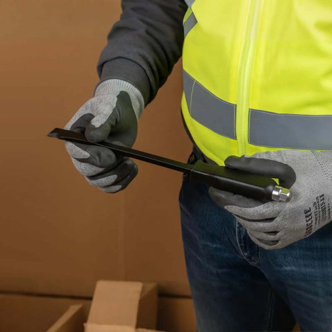 Person holding 12 Inch Duct Slitter Hand Sheet Slicer for cutting metal pipes and duct work, showing beveled notch tip.