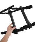 Heavy Duty Under Desk PC Tower Mount Rack With Stainless Steel Anti Vibration Caging and Heavy Duty Ratchet Straps held in hand.