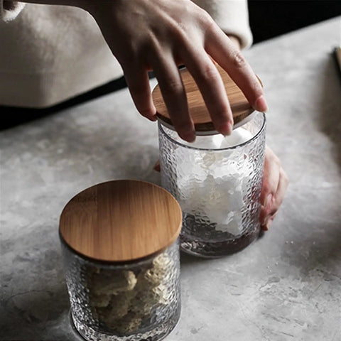 Top Shelf Airtight Glass Storage Jars 320 Milliliters With Durable Sealed Lids for coffee beans and spices, being opened on a marble surface.