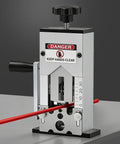 Close-up of Heavy Duty Manual Wire Stripping Machine With Ergonomic Hand Crank And Drill Adapter, showing wire feed and adjustment scale.