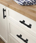 10 Pack 3 Inch Matte Black Cabinet Pulls With Solid Steel Construction And Zinc Alloy Base installed on white kitchen cabinets