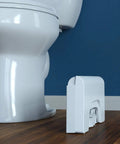 Fold N Stow Compact Foldable Toilet Stool White 8 Inch Space Saving Design folded beside white toilet on wooden floor