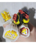 Heavy Duty EV Car Controller For 48V 60V 72V AC Motor Drives connectors in hand, showcasing various sizes and colors for universal fit.