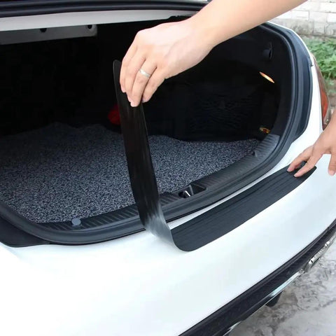 Tesla Cybertruck Rear Trunk Sill Guard Strip Heavy Duty Rubber bumper protector being applied inside the trunk.