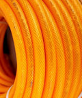 1/4 Inch By 100 Feet Hybrid Polymer Air Hose With Bend Restrictors ultra lightweight coiled and ready for heavy-duty use.