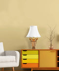 White Bell Scalloped Table Lamp Shade With Brass Harp Set on wooden cabinet in modern living room scene