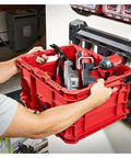 Person installing red Packout Compatible Tool Storage Crate Built Tough With Impact Resistant Polymer 50 Lb Capacity For Milwaukee PACKOUT System