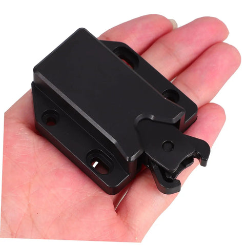 Push To Open Cabinet Latch Kit Four Pack With Rebound Tech held in hand, showcasing black thickened plastic construction.