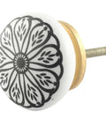 Close-up of Flat Out Gorgeous Ceramic Black Daisy Drawer Knobs Rock Solid Collection Of One Hundred for cabinets and dressers.