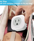 Person placing 3 Pack European Travel Plug Adapter With 2 US Outlets All In One EU to US Power Adapter in a travel bag