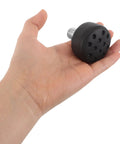 Person holding adjustable non-marking rubber pad, Toe Stops and Brake Blocks for Quad Roller Skates, ideal for outdoor skating