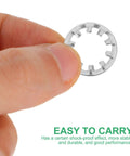 Close-up of a person holding a stainless steel internal tooth lock washer from the Serrated Star Shape 300Pcs Assortment Kit for fasteners.