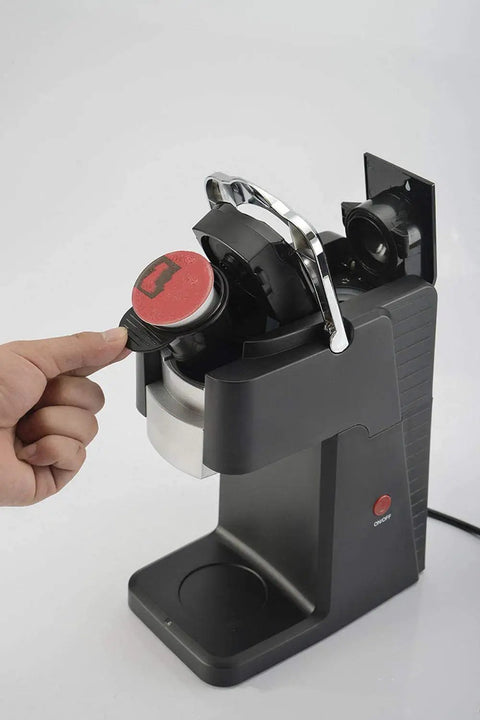 Hand inserting capsule into Bean To Cup Coffee Maker For Home Use With Capsule Compatibility And Portable Design Real Barista Experience At Home