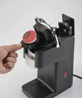 Person inserting capsule into Bean To Cup Coffee Machine For Home Use Capsule Espresso Maker With Reusable Filter And Backlit Touch Panel