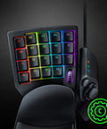 Mecha-Membrane Gaming Keypad With 32 Programmable Keys, Customizable RGB Lighting, shown with ergonomic design for one-handed control