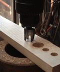 Legit Top Tier Wood Plug Cutter Drill Bit Set Eight Piece Collection in use on wood cutting holes for fast furniture fixes.