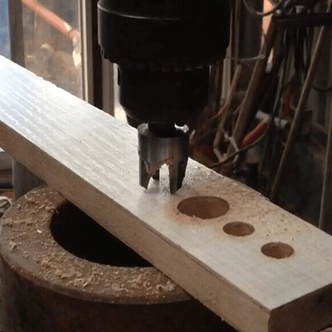 Legit Top Tier Wood Plug Cutter Drill Bit Set Eight Piece Collection in use on wood cutting holes for fast furniture fixes.