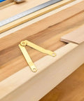 Beefy Heavy Duty Box Lid Support Hinges Gold Tone Iron Folding Hinges on wooden surface