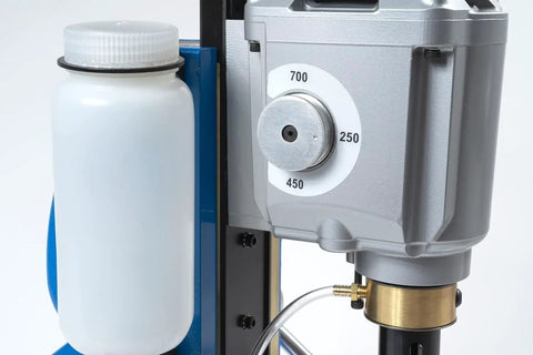 Heavy Duty 115 Volt Magnetic Drill Built Like A Tank With Kickin Three Speed Gearing Up To Two Three Eighths Inch Capacity Includes coolant jug and RPM dial.