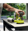 One Plus Compatible 18V Cordless 5 Inch Random Orbit Sander Tool Only with Hook and Loop Pads in use on table surface