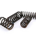 Get These Badass Black Spring Steel Compression Springs For Your Rig Or Shed. Two metal compression springs on a white background.