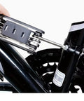 Using 16 In 1 Bicycle Multitool With Tire Levers And Spoke Wrench on a bike frame