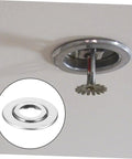 Twenty Pack Heavy Duty Stainless Steel Double Disc Escutcheon Plates For Fire Sprinkler Heads shown mounted on ceiling.