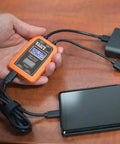 Hand holding USB Power Meter For USB A And USB C Digital Voltage, Current, Capacity, Energy And Resistance Tester