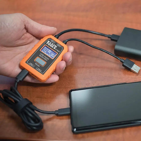 Hand holding USB Power Meter For USB A And USB C Digital Voltage, Current, Capacity, Energy And Resistance Tester