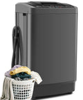 Smooth Operation Compact Portable Washer With Fast Drain Pump And Twenty Pound Laundry Capacity In Classic Gray beside a basket of laundry.