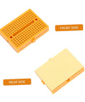 Hella Handy Six Piece Solderless Breadboard Kit For Circuit Prototyping And Science Experiments front and rear view of orange board.