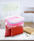 2 Pack Acrylic Food Prep Bag Holder Stand with filled red bag on kitchen counter