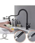 Black Pull Out Deck Mounted Flexible Hot Cold Stream Shower Modes Nozzle Faucet in modern kitchen with hand washing. 