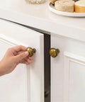 Hand opening cabinet with 30 Pack Antique Brass Drawer Knobs 1-1/4 Inch, Solid Zinc Alloy Round Cabinet Knobs, Easy Install