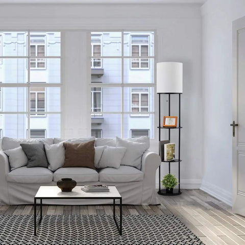 Versailles Floor Lamp With Built-In Shelves, 57.5 Inch Matte Black, White Linen Shade next to white sofa in bright living room.