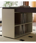 Top Shelf Standing Desk With Sleek Smoky Matte Paint Boss Ready Computer Workstation featuring a storage cubby with books.